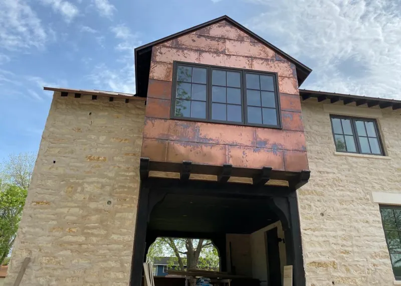 Copper metal panel facade on a stone building for Skylight Installation in Fairview Heights